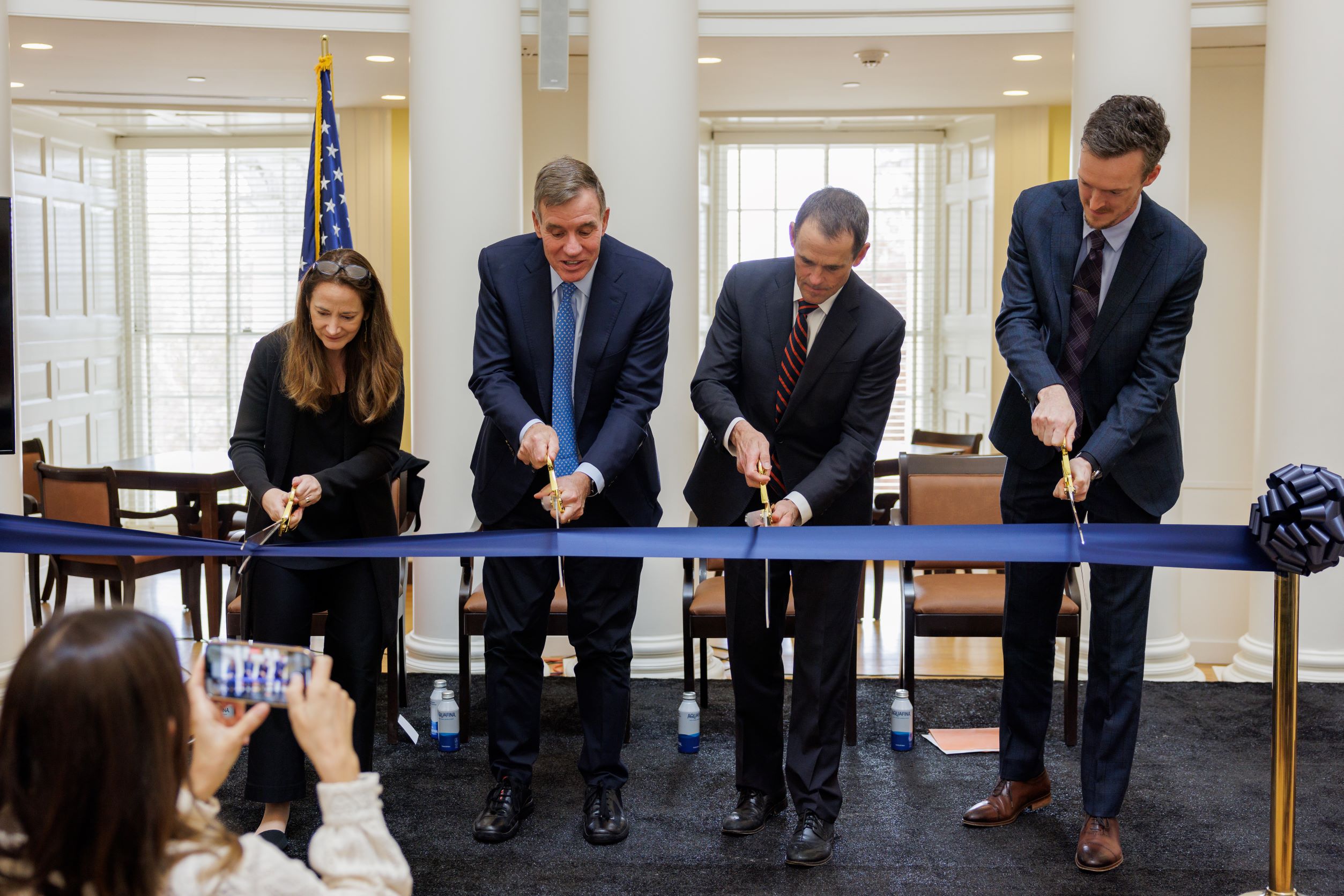 Director of National Intelligence Avril Haines, Senate Select Committee on Intelligence Chairman Mark Warner (D-Virginia), UVA President Jim Ryan and National Security Data and Policy Institute Director Philip Potter cut a ceremonial ribbon to mark the opening of the institute. 